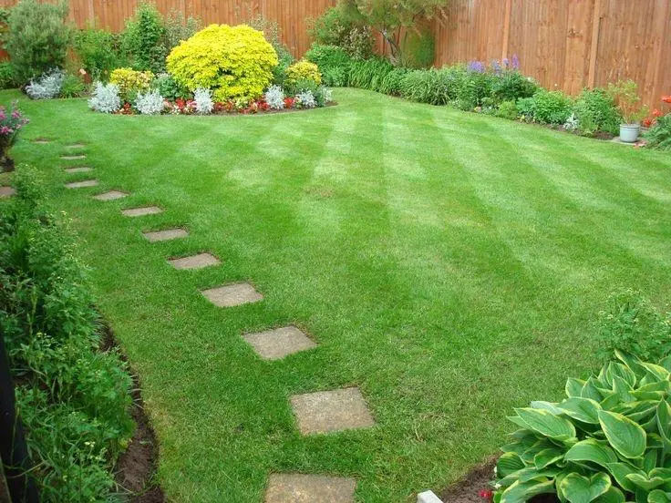 Professional gardening services including lawn mowing, pruning, and edging in Manchester